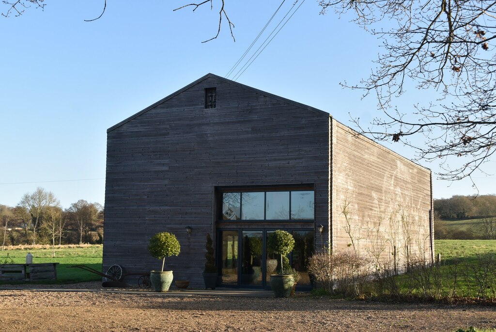 Inspiration: a timber-clad barn conversion with glazed entrance and surrounding countryside